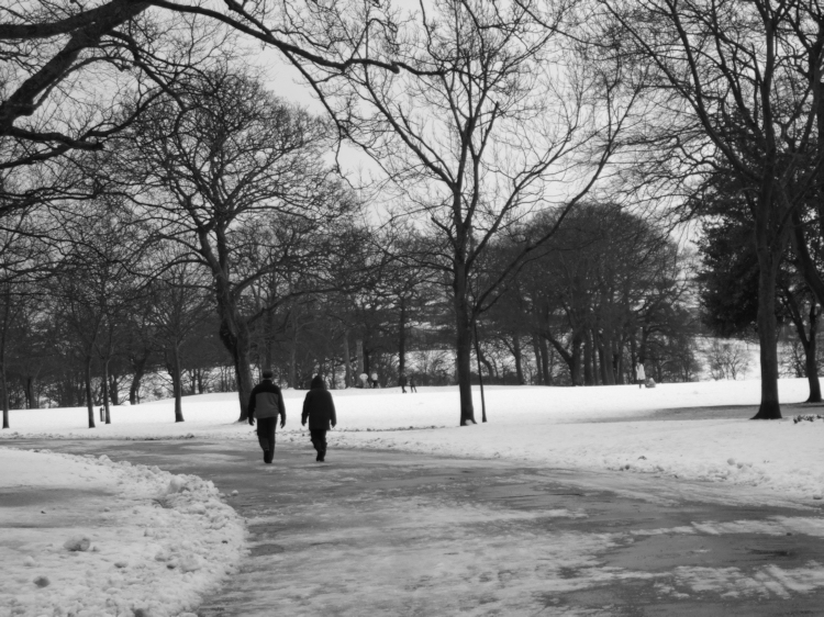 Two people walking in the snow, Duthie Park, Aberdeen